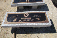 Moonlight grey granite with attached bronze plaque and vase