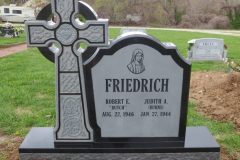 Jet black sculpted cross.